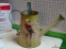 (BACK) DECORATIVE METAL WATERING CAN; LARGE GREEN AND CREAM COLORED METAL WATERING CAN WITH CARRYING
