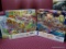 (BACK) LOT OF 750 PIECE PUZZLES; THIS LOT INCLUDES TWO BOXES WITH PUZZLES INSIDE. BOTH ARE 750