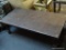 (BACK) SOLID WOOD COFFEE TABLE; RECTANGULAR SHAPE WITH PEGGED CONSTRUCTION, TURNED SLIGHTLY SPLAYING