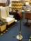 (BACK) BRASS FLOOR LAMP WITH CHEVRON SHADE; TALL BRASS FLOOR LAMP WITH EXTENDABLE ARM. THIS LAMP HAS