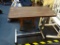 (BACK) VINTAGE WOOD GRAIN OVER BED TABLE; WOOD-GRAINED LAMINATED TOP WITH FLUSH-MOUNTED T-MOLDED