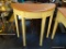 (BACK) HALF-MOON SHAPED HALL TABLE; TAN IN COLOR WITH WOOD GRAIN TOP SURFACE, TAPER BLOCK LEGS, AND