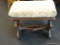 VICTORIAN FOOTSTOOL; VICTORIAN UPHOLSTERED TRESTLE BASE FOOTSTOOL. MEASURES 20 IN X 11 IN X 17 IN