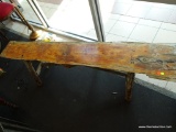 (WIN) PRIMITIVE WOODEN BENCH; SINGLE LONG PLANK OF KNOTTY PINE, PEG CONSTRUCTED, WITH LIMB-LIKE LEGS