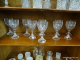 GLASS SHELF LOT; ITEMS FROM MIDDLE SHELF INSIDE CABINET INCLUDING 10 STEMMED GOBLETS WITH