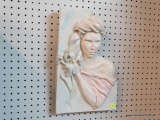 CERAMIC WOMAN WITH IRIS WALL PLAQUE; SILHOUETTE OF WOMAN HOLDING AN IRIS, IN PALE PINK AND BLUE