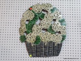 METAL FLORAL WALL HANGING; BASKET OF HYDRANGEAS DESIGN IN SHADES OF WHITE, GREEN, AND BLACK.