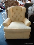 SUNNY YELLOW UPHOLSTERED SWIVEL ROCKING CHAIR; ROUNDED BACK, BUTTON TUFTED WITH PLEATED ARMS, PIPED