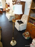 BRASS FLOOR LAMP WITH WHITE FLARED LAMPSHADE; CRYSTAL CROWN SHAPED FINIAL OVER A SLIGHTLY BELL