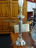 (WIN) BRUSHED SILVER COLORED MODERN TABLE LAMP; COMES WITH HARP AND FINIAL. ALSO HAS A BULB MARKED