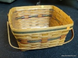 LONGABERGER BASKET; SQUARE DOUBLE HANDLED BASKET WITH PLASTIC LINER AND RED AND GREEN BANDED TRIM.
