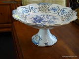 (WIN) WHITE AND BLUE PORCELAIN PEDESTAL DISH; SCALLOPED EDGES WITH PIERCED PANELED BORDER, WHITE
