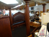 MAJESTIC COLUMN BED; HAS COLUMNAR WOOD GRAINED BED WITH LEATHER BACK AND SHELL CARVED CREST. CAN BE