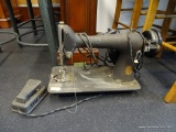 SINGER SEWING MACHINE; VINTAGE SINGER SEWING MACHINE WITH PEDAL AND TOOLS. SERIAL #AH744070. IN GOOD