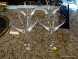 SET OF MARTINI GLASSES; SET OF 4 CLEAR GLASS MARTINI GLASSES. EACH MEASURES 7.5 IN X 5 IN DIAMETER.