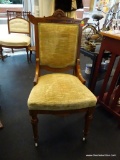 VICTORIAN SIDE CHAIR; 1 OF A PAIR OF VICTORIAN SIDE CHAIRS. EACH HAS A GREEN UPHOLSTERED SEAT AND