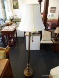 BRASS TONE FLOOR LAMP; CREAM COLORED BELL SHAPED SHADE ON AND EXTENDABLE ARM. THIS LAMP HAS A