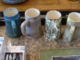 HOLLAND MOLD STEINS; TOTAL OF 4, ASSORTED COLORS AND FINISHES. ALL CERAMIC MOLDED WITH SINGLE