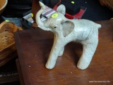 (BACK) ELEPHANT STATUE; CREAM COLORED MARBLE LOOK ELEPHANT STATUE WITH ITS TRUNK RAISED UP AND SHORT