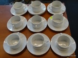 POTTERY BARN CUPS/SAUCER SETS; 9 CUPS AND 10 SAUCERS INCLUDED IN THIS LOT. MADE OF WHITE PORCELAIN,