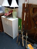 (BACK) LOT OF FISHING RODS AND REELS; THIS LOT CONTAINS 4 FISHING RODS. 3 OF WHICH HAVE ATTACHED