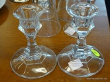 SET OF GLASS CANDLESTICK HOLDERS; SET OF TWO CLEAR GLASS CANDLESTICK HOLDERS . MEASURES 4 IN TALL.