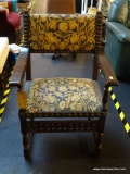 (BACK) ANTIQUE EDWARDIAN CARVED ARMCHAIR WITH BLACK FLORAL UPHOLSTERED BACK AND SEAT; DARK WOOD