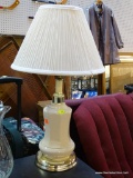 (BACK) WHITE PORCELAIN TABLE LAMP; THIS WHITE PORCELAIN AND BRASS TONED TABLE LAMP HAS A PLEATED