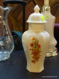 (BACK) GINGER JAR; CREAM COLORED FLORAL PATTERN AND PANELLED GINGER JAR WITH LID. IS IN GOOD USED