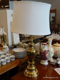 TABLE LAMP; BRASS TABLE LAMP WITH LARGE ROUND SHADE AND FINIAL. MEASURES 32 IN TALL