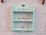 SMALL HANGING WOODEN WALL SHELF; MINT GREEN IN COLOR, SINGLE HEART CUTOUT AT OP OVER 3 SHELVES.
