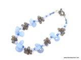 QUALITY STERLING SILVER AND GEMSTONE CLUSTER NECKLACE, FEATURING LIGHT BLUE FACETED STONES,