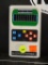 VINTAGE ELECTRONIC FOOTBALL HANDHELD GAME; MADE BY MATTEL, WHITE PLASTIC CASE WITH GREEN FOOTBALL