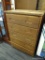 VINTAGE WOODEN CHEST OF DRAWERS. RECTANGULAR WOOD PLANK TOP WITH 5 DRAWERS WITH CARVED HANDLES. THIS