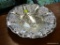 DAVCO SILVER PLATE BOWL; IS TARNISH RESISTANT AND SITS UPON 3 FEET. MEASURES 12 IN DIA.