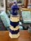 WOODEN HAND PAINTED LIGHTHOUSE SHAPED BIRDHOUSE; COBALT BLUE AND OFF WHITE HORIZONTAL STRIPES,