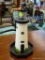 FAITH ROLLINS PAINTED WOODEN HANGING LIGHTHOUSE; OFF WHITE WITH BLACK TRIM AND OCTAGON-SHAPED BASE.