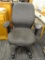 BLACK PATTERNED ROLLING OFFICE CHAIR; BLACK OFFICE CHAIR WITH BLACK AND WHITE UPHOLSTERY, PADDED