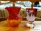 VINTAGE RED GLASS LOT; TOTAL OF 2 ITEMS. ONE IS A RED AND YELLOW ART GLASS SINGLE HANDLED PITCHER