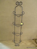 WIRE PLATE RACK; SCROLLING METAL WIRE PATTERNED RACK HOLDS 4 PLATES, MEASURES 5.5 IN WIDE AND 25.5
