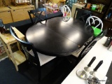AMERICAN SIGNATURE TABLE AND CHAIRS; BLACK OVAL TABLE WITH ONE 18 IN LEAF AND PEWTER CAPPED FEET AND