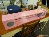 PORTABLE SPEAKERS IN PINK CABINET; MEASURES 3 FT LONG X 6 IN X 7 IN. HAS SOME CREATIVE GRAFFITI