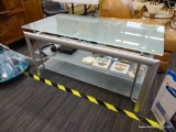 TV/ENTERTAINMENT STAND; MAXIM MAGAZINE GLASS TV STAND WITH 2 LOWER SHELVES. IS IN EXCELLENT