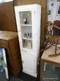 WHITE GLASS FRONT CABINET; HAS A PAIR OF DOORS STACKED ONE ON TOP OF OTHER. TOP IS GLASS FRONT DOOR