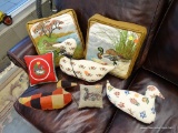ASSORTED LOT OF THROW PILLOWS. THIS LOT CONTAINS 9 ASSORTED THROW PILLOWS. 3 ARE SCULPTED DUCK