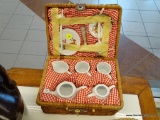 MINIATURE 10 IN X 7 IN X 5 IN. CHRISTMAS TEA SET IN BASKET; THIS IS A WOVEN BASKET WITH RED AND