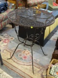 PATIO END TABLE; CAST IRON AND MESHED WIRE PATIO END TABLE WITH HEART SHAPED ACCENTS ON THE LEGS.