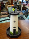 FAITH ROLLINS PAINTED WOODEN HANGING LIGHTHOUSE; OFF WHITE WITH BLACK TRIM AND OCTAGON-SHAPED BASE.