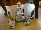 LIGHTHOUSE FIGURINES LOT; 6 TOTAL PIECES. 8 IN TALL CERAMIC LIGHTHOUSE IN WHITE, TAN, AND BLUE, 2