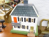 VINTAGE WOODEN DOLL HOUSE; WHITE WOODEN DOLLHOUSE WITH BLACK SHUTTERS AND A RED FRONT DOOR. THIS